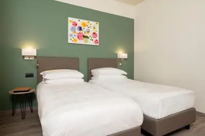 Letto o letti in una camera di Hotel Plaza