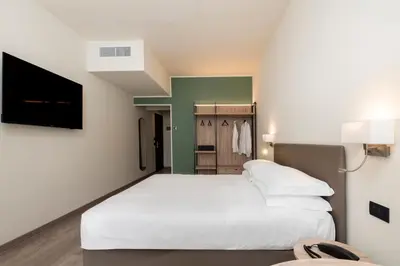 Letto o letti in una camera di Hotel Plaza