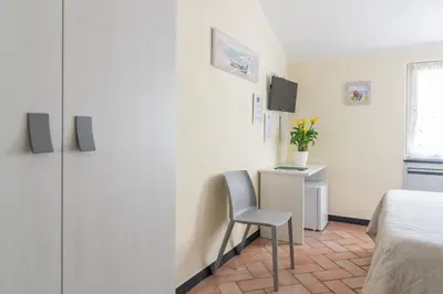 Letto o letti in una camera di B&B Vignola