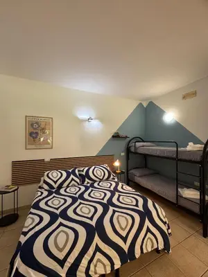 Letto o letti in una camera di Agriturismo Corte San Girolamo