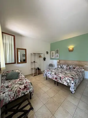 Letto o letti in una camera di Agriturismo Corte San Girolamo