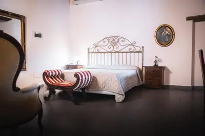 Letto o letti in una camera di Hotel La Tavola Rotonda