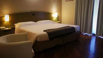 Letto o letti in una camera di Albergo Della Roccia