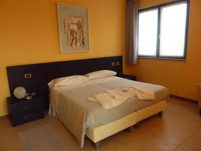 Letto o letti in una camera di Hotel Padus Meublè Parma