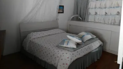 Letto o letti in una camera di a casa di Marzia