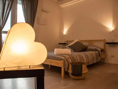 Letto o letti in una camera di Agriturismo Orto dei Rolli