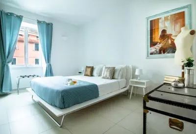 Letto o letti in una camera di Casa Giulia - Apartment beachfront with 2 bedrooms, air conditioning and private parking, just 30 meters from the beach