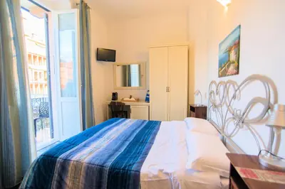 Letto o letti in una camera di Affittacamere Agata