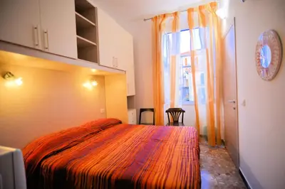 Letto o letti in una camera di Affittacamere Agata