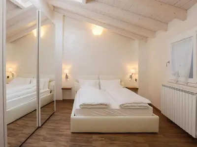 Letto o letti in una camera di Les Suites
