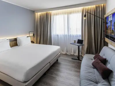 Letto o letti in una camera di Novotel Parma Centro