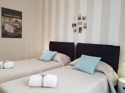 Letto o letti in una camera di Parma City Centre Holiday House