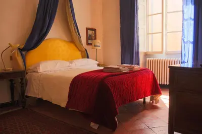 Letto o letti in una camera di B&B Palazzo Malaspina