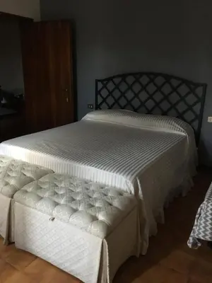 Letto o letti in una camera di Casa Bellodi