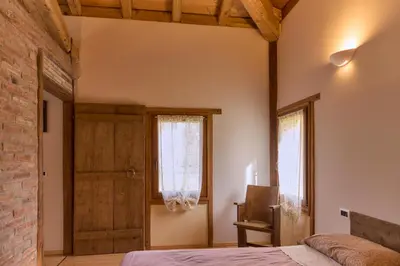 Letto o letti in una camera di Ca' Biscòtt