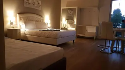 Letto o letti in una camera di B&B Emozioni e Relax