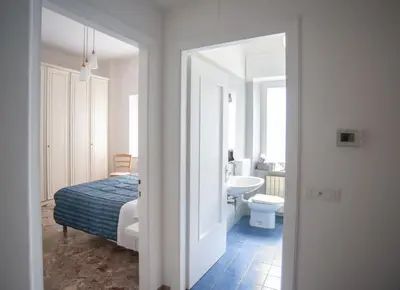 Letto o letti in una camera di Appartamento Arcobaleno