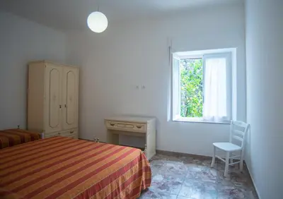 Letto o letti in una camera di Appartamento Arcobaleno