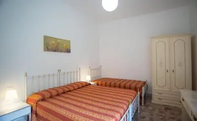 Letto o letti in una camera di Appartamento Arcobaleno
