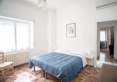 Letto o letti in una camera di Appartamento Arcobaleno