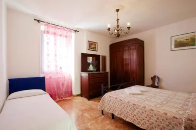 Letto o letti in una camera di Casa Angela