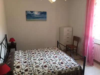 Letto o letti in una camera di Casa Angela
