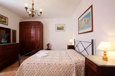 Letto o letti in una camera di Casa Angela