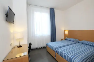 Letto o letti in una camera di Hotel Genova