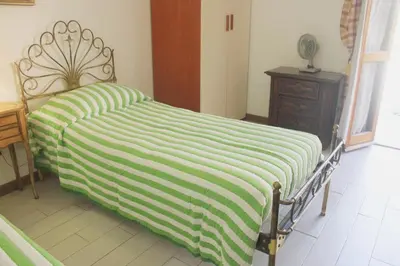 Letto o letti in una camera di Appartamento Primula Rossa