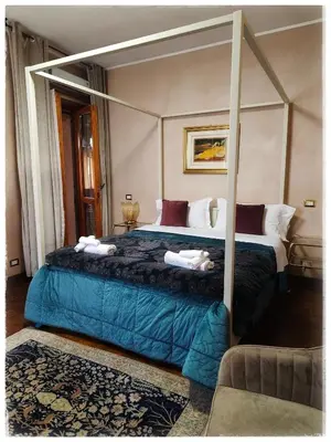 Letto o letti in una camera di Villa Marisa