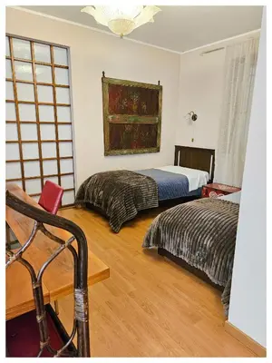 Letto o letti in una camera di Villa Marisa