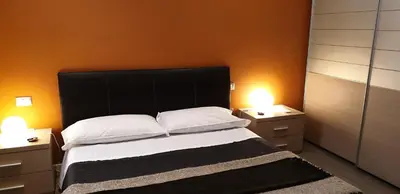 Letto o letti in una camera di Agorà Residenza