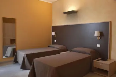 Letto o letti in una camera di Silver Residence Hotel