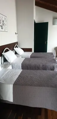 Letto o letti in una camera di Hotel Sporting