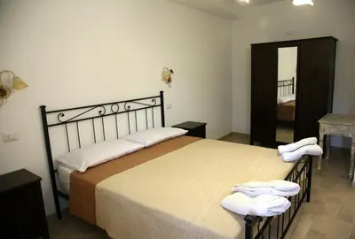 Letto o letti in una camera di Fior d'olivo - Villa con piscina privata a pochi minuti dal centro di Sestri Levante, mare e spiaggie