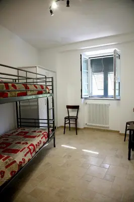 Letto o letti in una camera di Fior d'olivo - Villa con piscina privata a pochi minuti dal centro di Sestri Levante, mare e spiaggie