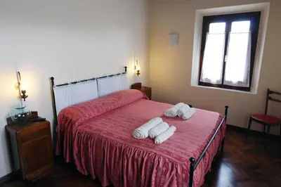 Letto o letti in una camera di B&B Le Noci di Feo