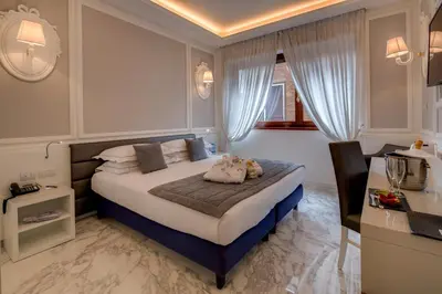 Letto o letti in una camera di Grande Albergo Roma