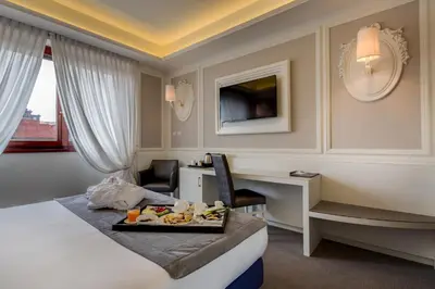 Letto o letti in una camera di Grande Albergo Roma