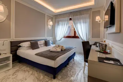 Letto o letti in una camera di Grande Albergo Roma