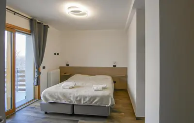 Letto o letti in una camera di B&B Passo del Cerreto
