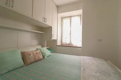 Letto o letti in una camera di La Riva