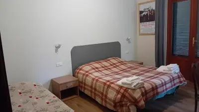Letto o letti in una camera di CIAK Affittacamere