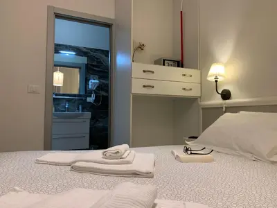Letto o letti in una camera di Affittacamere LevantoMare