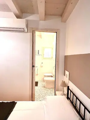 Letto o letti in una camera di RESIDENZA SERENA B&B - Centro Storico