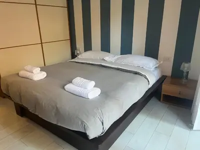 Letto o letti in una camera di Casa Lavagna giardinetto