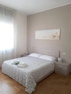 Letto o letti in una camera di Casa Claudia
