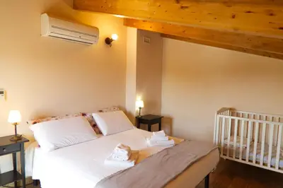 Letto o letti in una camera di Antico Casale Caroli