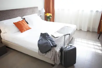 Letto o letti in una camera di RMH MODENA DES ARTS