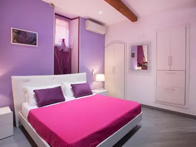 Letto o letti in una camera di I Coralli rooms & apartments